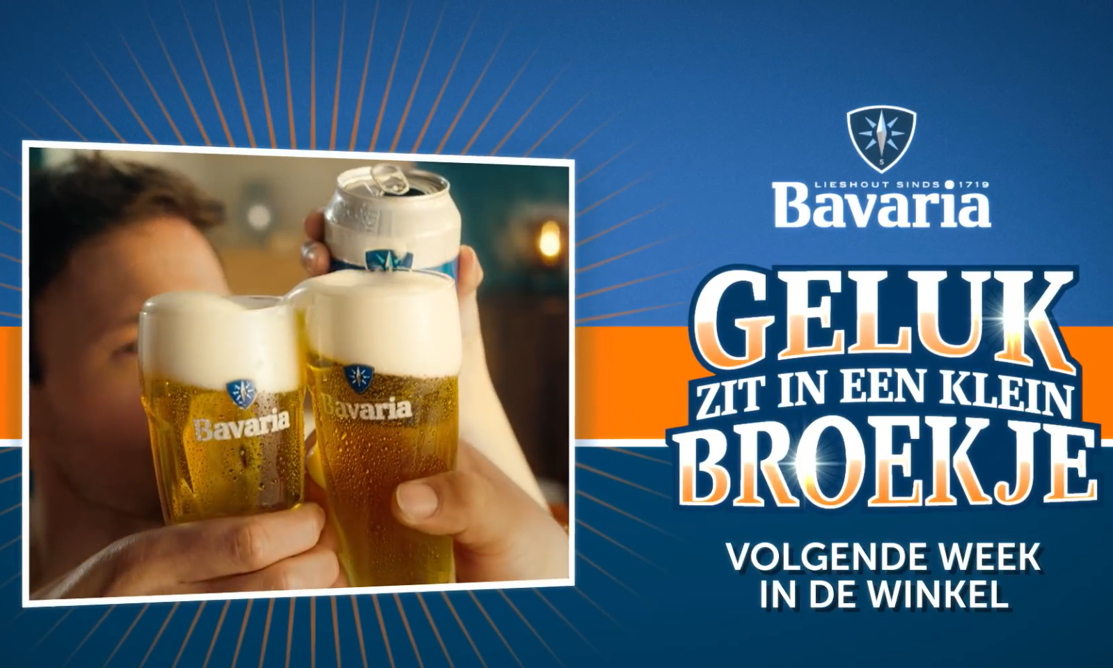 Man heft een Bavaria-biertje met schuimkraag en 