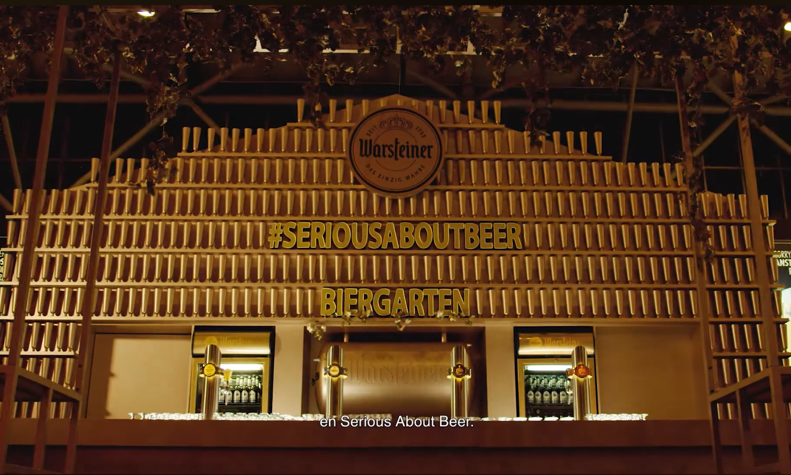 Biergarten met Warsteiner logo en #SeriousAboutBeer slogan.