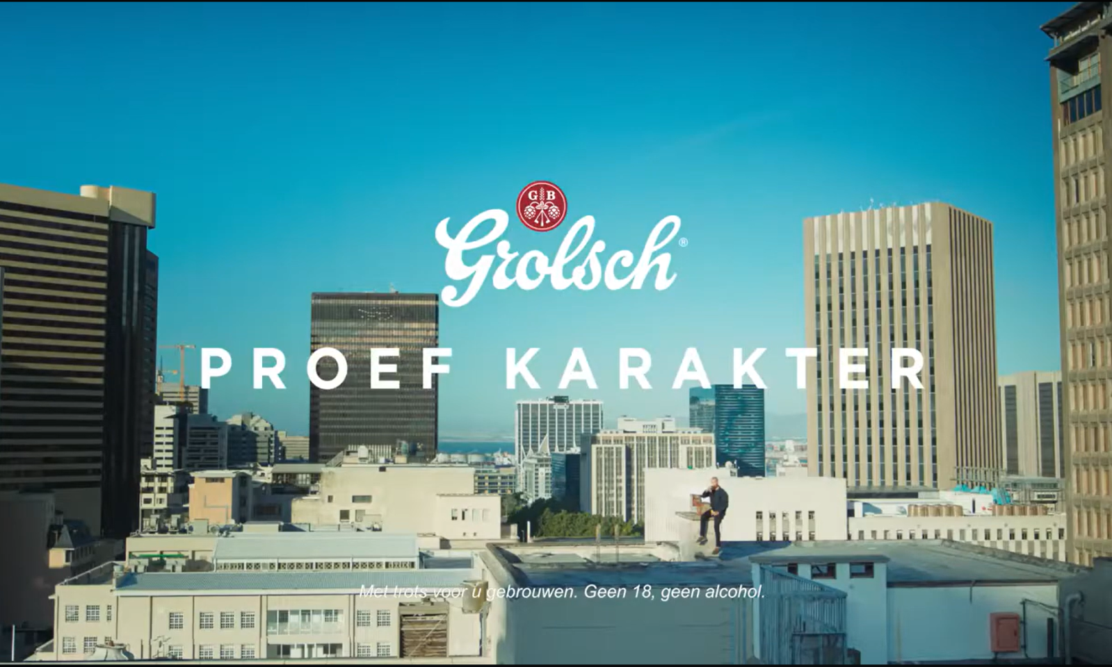 Skyline met Grolsch logo en tekst Proef Karakter op de voorgrond.